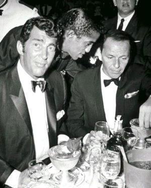 Dean Martin, Sammy Davis Jr and Frank Sinatra - a word in the chairman's ear
