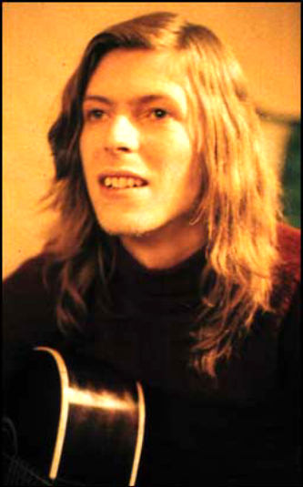 pretty young David Bowie with the flowing long hair