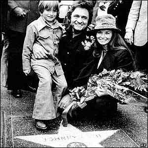 Johnny Cash receives his star on the Hollywood Walk of Fame, with June and John Jr