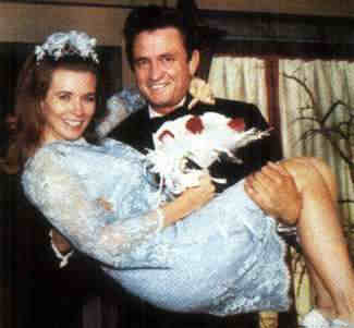 Johnny carries June Carter Cash across the threshold