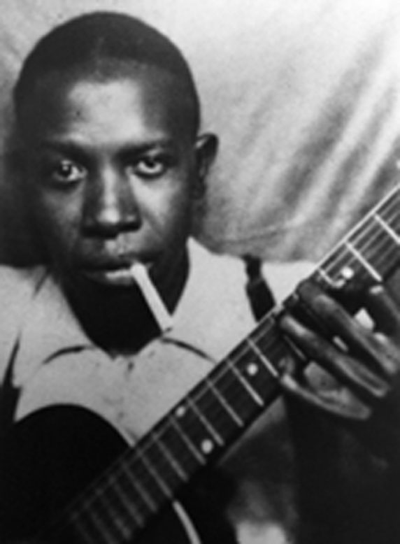 blues guitarist and songwriter Robert Johnson smoking a cigarette
