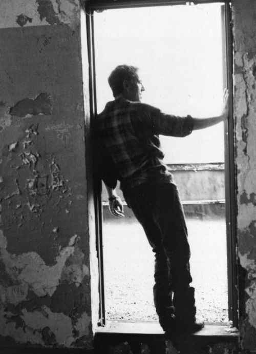 Bruce Springsteen looking out of a doorway